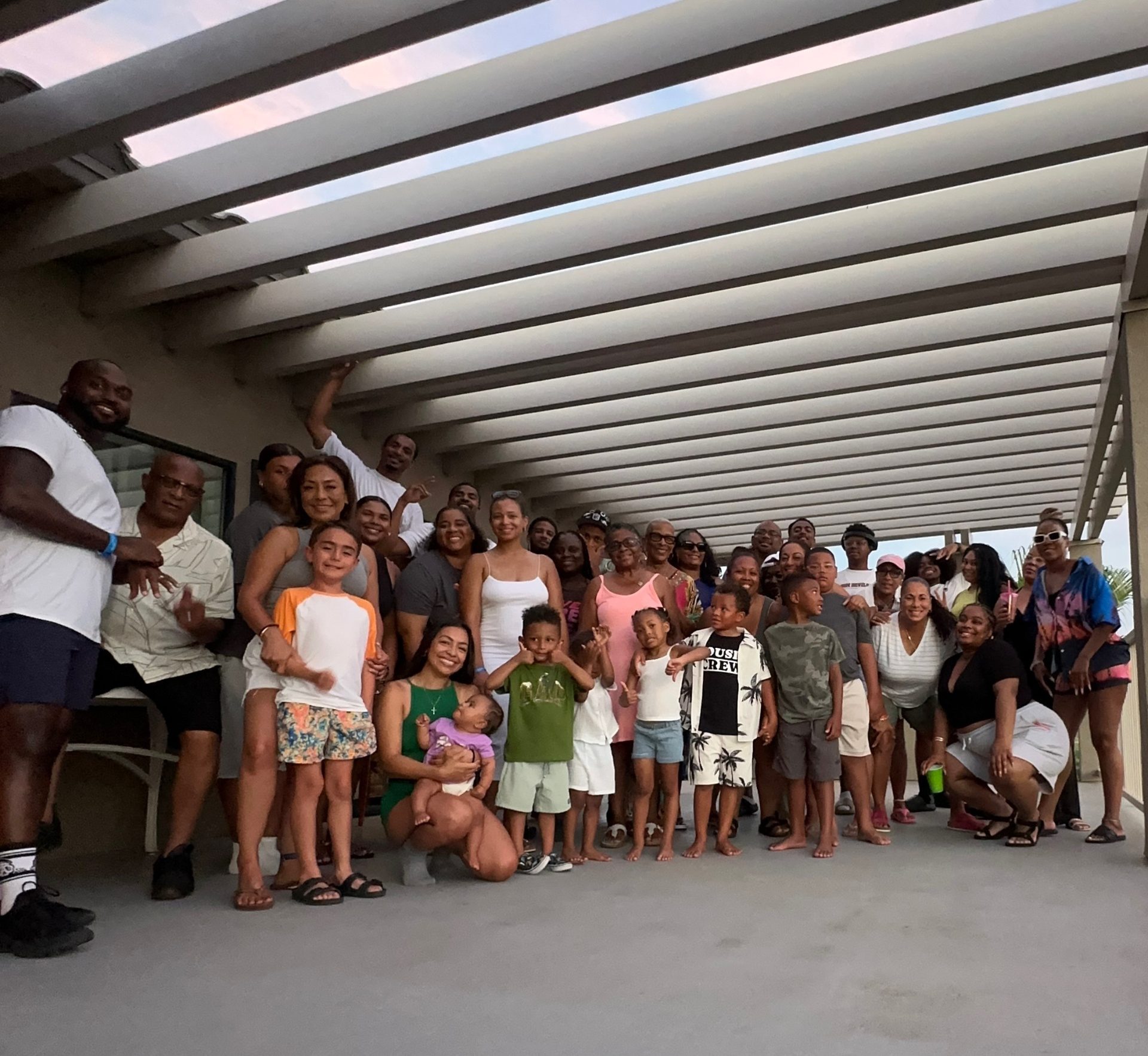 The whole family posed together on the patio at sunset